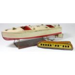 A Lionel Craft tinplate boat, wind up, key and stand, 43cm long, together with a Golden Streak