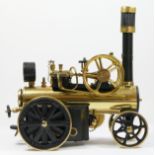 A Wilesco D430 brass live steam traction engine, unfired, with instructions, 28cm.
