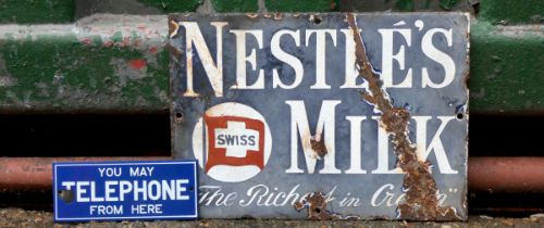 A single sided enamel sign Nestles Milk, 26cm x 18cm, together with a single sided enamel sign,