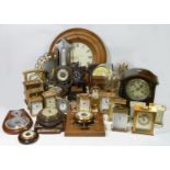 A collection of anniversary clocks, carriage clocks and barometers, manual & quartz movements.(4)