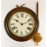 A late 19th Century wall clock, mahogany cased, brass bezel with enameled dial and Roman numerals,