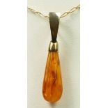 A 9ct gold mounted amber pendant, chain, 1.9gm