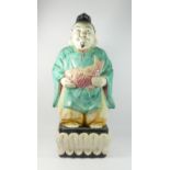 A large Chinese glazed pottery figure of a fisherman, 67cm