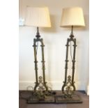 A pair of Victorian cast iron terrace railings, converted to standard lamps, mounted on stepped cast