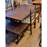 A dark wood dining table, extendable with hidden leaf, 220cm x 91cm x 74cm (extended), together with