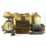 A collection of early 20th Century and later wares to include four stoneware flagons, two cast metal