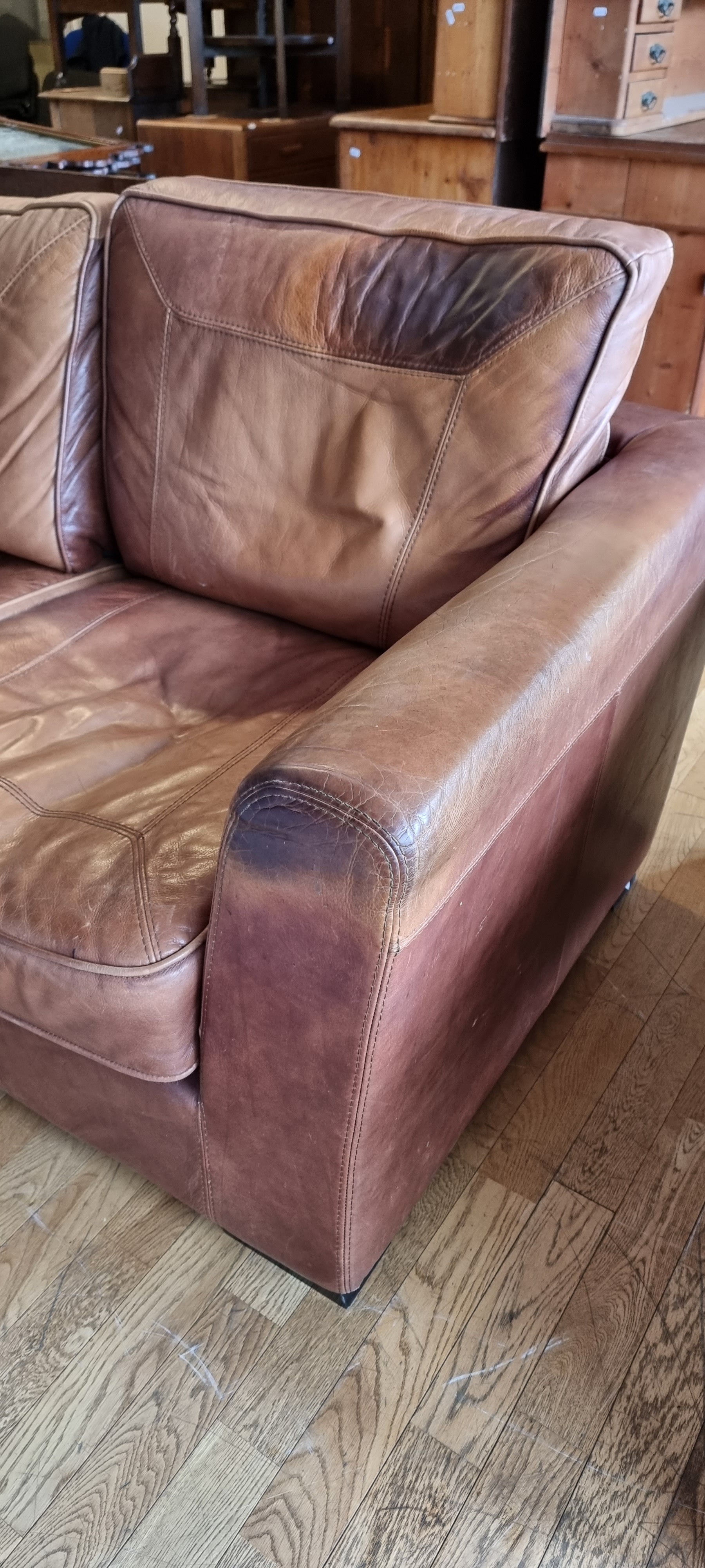 A tan leather two seater sofa, 170 x 95 x 83cm. - Image 2 of 3