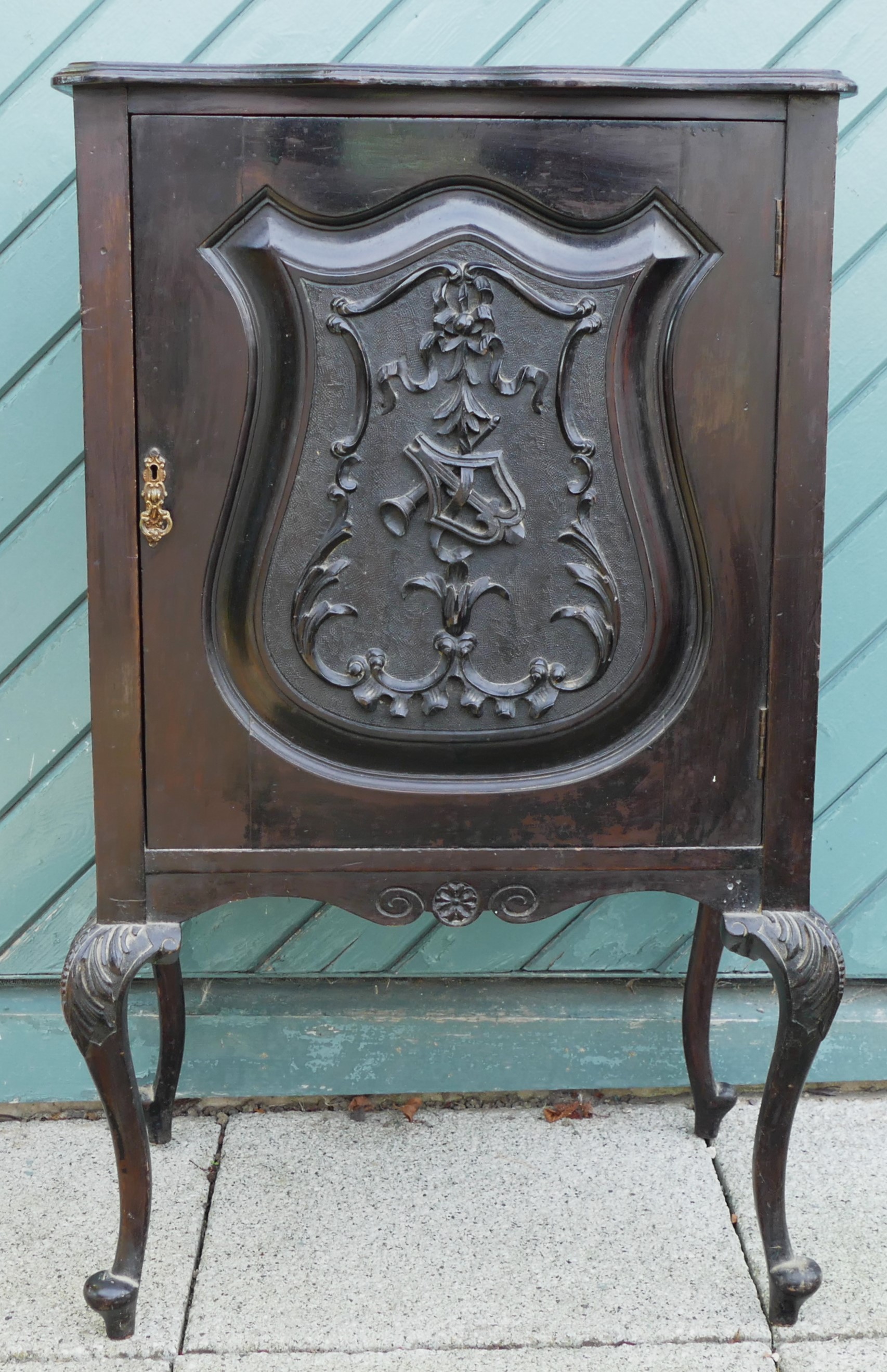 A French Louis XIV style ebonised music cabinet having scalloped edge top above a carved panel door, - Image 2 of 2