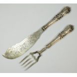 A Victorian silver pair of fish servers, Sheffield 1851, engraved blades, with loaded handles