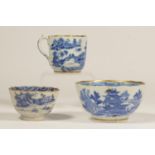 An 18th century Caughley tea cup, with pagoda decoration, a matching slop bowl, repaired and a
