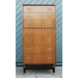 E.Gomme for G-Plan 1950s seven height narrow chest of drawers, each with brass ring handles united