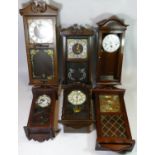 A collection of seven Vienna style wall clocks, having manual wind 8 day and 30 day movements.