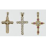 A 10K gold and brilliant cut diamond set cross pendant, 27 x 14mm, another diamond set cross and a
