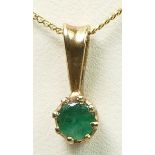 A 9ct gold mounted emerald single stone ring, chain, 1.1gm