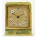 An Elliott 8 day mantle clock, green veined onex case, silvered dial, brass bezel with Roman