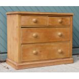 An early 20th Century stripped pine 2+2 height chest of drawers turned handles raised on a