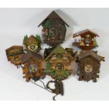 A collection of seven mid 20th century cuckoo clocks, having manual wind Swiss & German one day