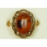 A 9ct gold mounted amber dress ring, R 1/2, 2.5gm
