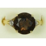 A 9ct gold, smokey quartz and diamond set ring, M, 1.7gm