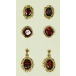 Three pairs of 9ct gold mounted garnet ear rings, 5.6gm