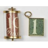 A 9ct gold cased emergency £1 note charm and a similar 10 shilling charm