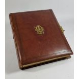 A Victorian Japonesque leather bound photograph album, by U.L.R. & Co., the pages with gilt Japanese