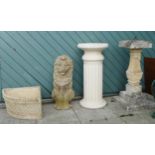 Four garden ornaments to include a composition lion - 65cm tall, a column, a corner planter by