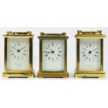 Three brass cased carriage clocks, having enameled dials with roman numerals and 8 day movements. (