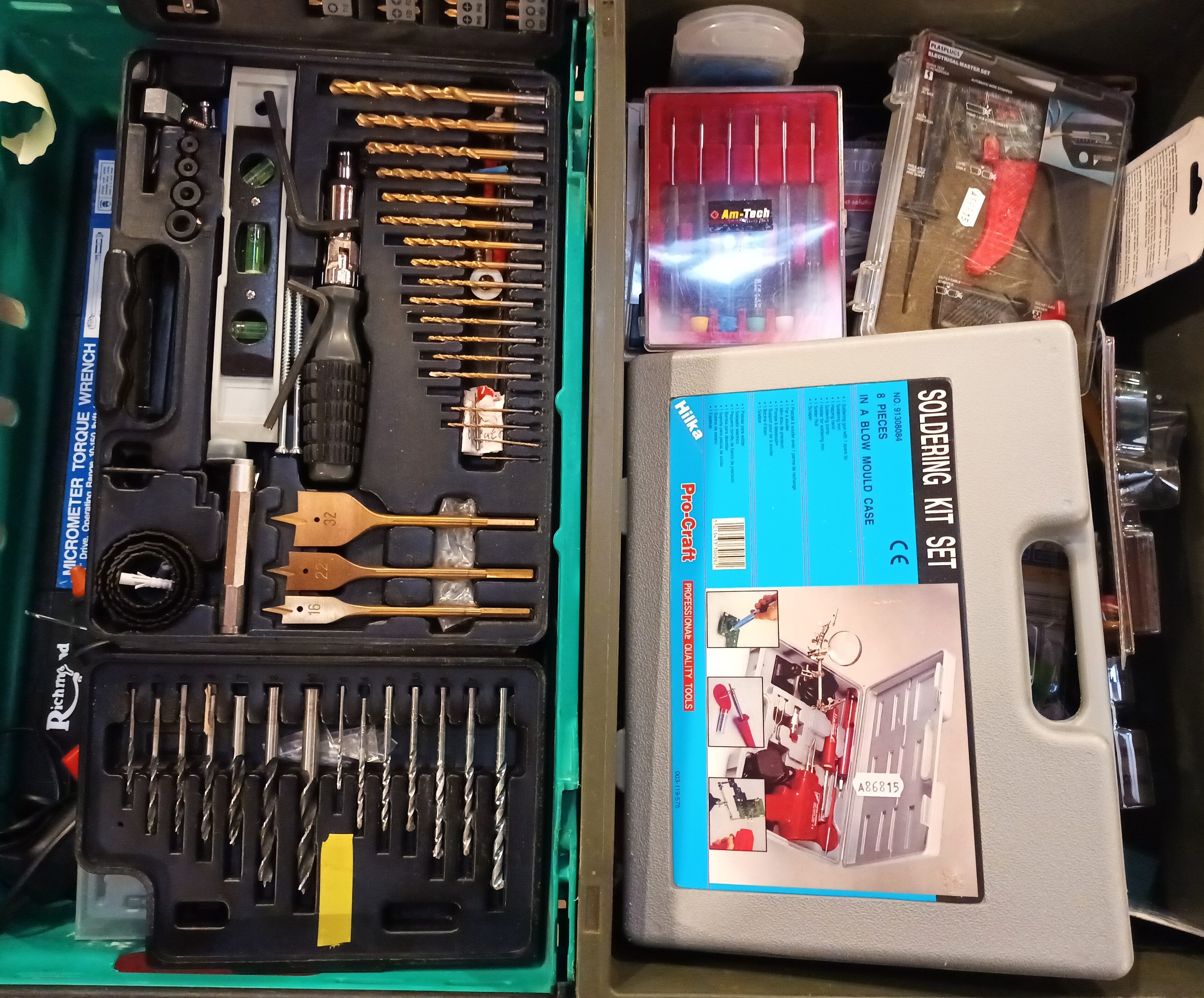 A collection of tools and accessories to include socket sets, Bosch drill set, soldering kit, comb