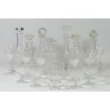 A collection of seven cut glass & crystal drinks decanters, together with a selection of drinking