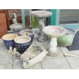 A collection of garden urns and ornaments to include glazed stoneware planters, composition bird