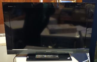 A Sony Bravia 32 inch LCD TV, together with a wall bracket and a Creda "Coldair" air conditioning