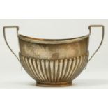 A silver sugar bowl, Birmingham 1938, with half fluted decoration, 84gm