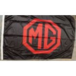 An MG forecourt flag, a Rover 200 series flag and an Austin Rover flag, all apparently unused and