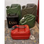 Two x 5 gallon Jerry cans, a vintage ESSO 2 gallon can, and two other petrol cans.