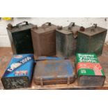 Two Esso 2 gallon cans (caps Shell and AAO Co. Ld), a 1 gallon can and two oil cans.