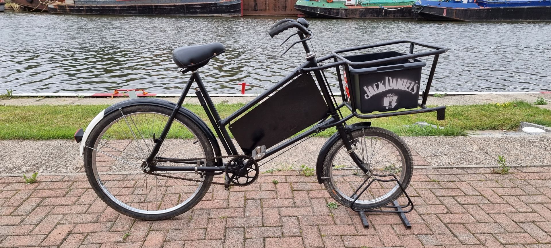 A vintage black painted butchers bicycle, with rod brakes