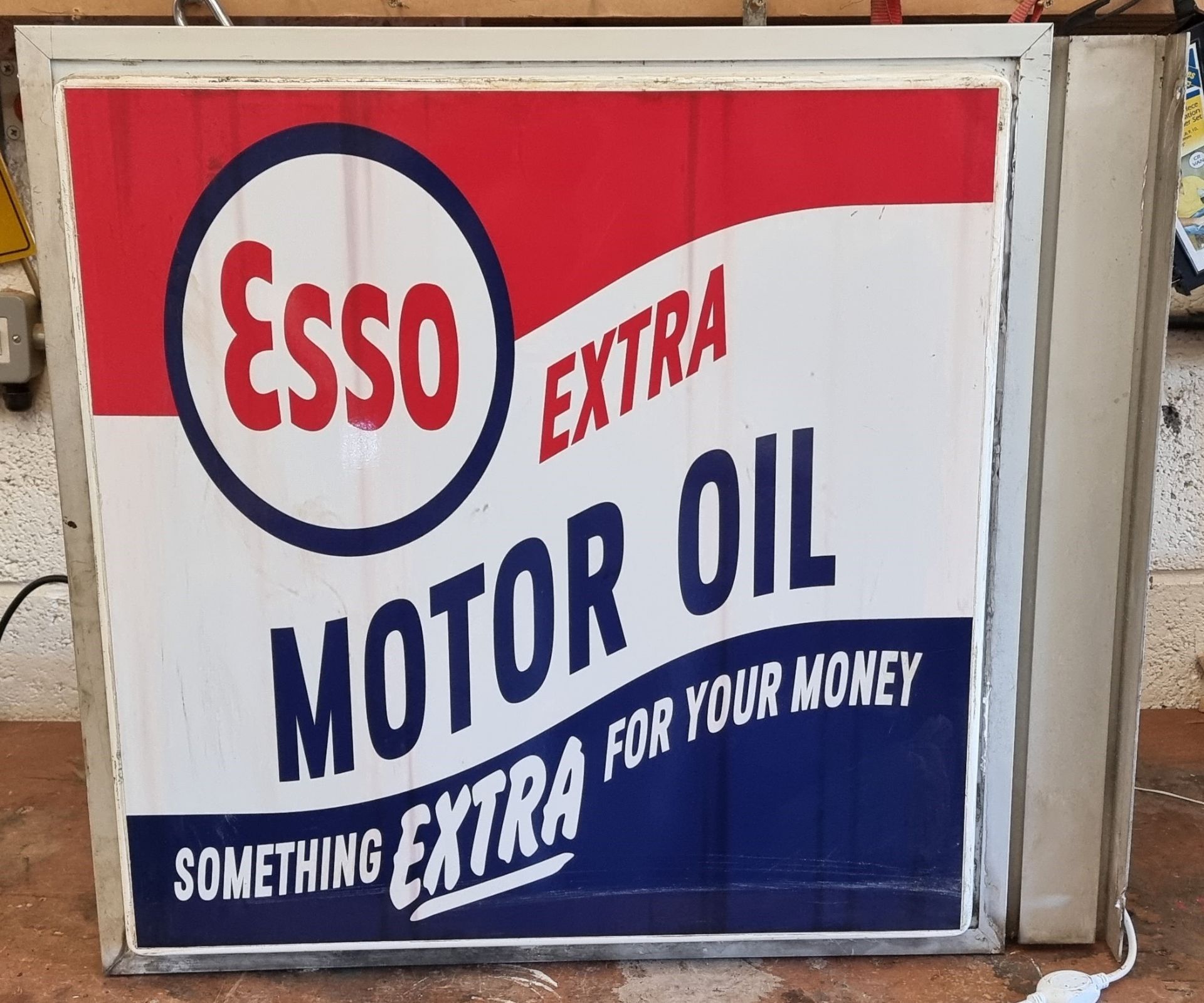 An Esso Extra Motor Oil Perspex double sided, wall mounted illuminated advertising sign, 72 x 65 x