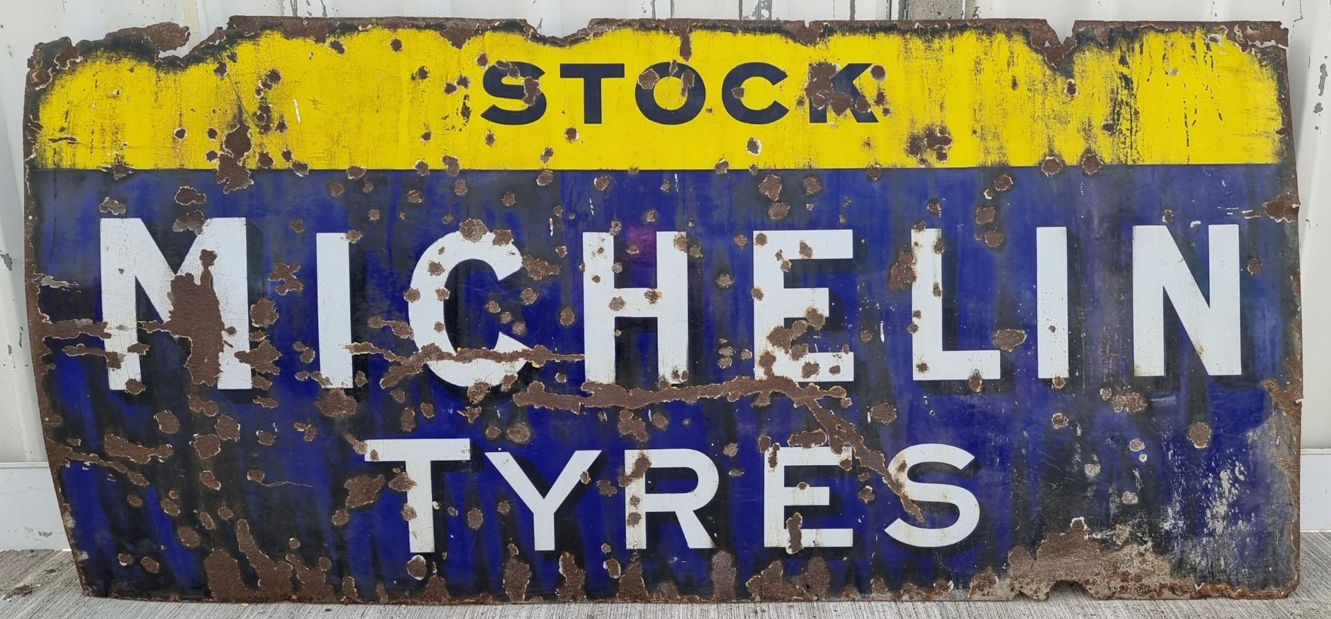 A Stock Michelin Tyres, vintage, vitreous enamel, single sided advertising sign, 102 x 213cm.