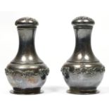 A pair of American Sterling silver pepper pots, by Gorham, c.1980's, with embossed floral