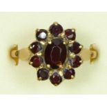 A 9ct gold and garnet cluster ring, N 1/2, 3.6gm