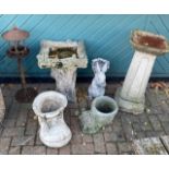 A collection of garden ornaments, to include composite bird baths, novelty planters and a cast metal