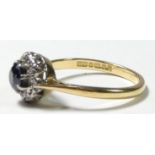 An 18ct gold sapphire and diamond cluster ring, M 1/2, 3.2gm