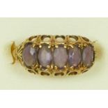 A 9ct gold Edwardian style amethyst five stone ring, K 1/2, 2.2gm