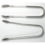 A George III silver bright cut pair of sugar tongs, London 1800 and a pair of provincial tongs by