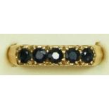 A 9ct gold and sapphire five stone ring, O, 2.5gm