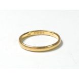 A 22ct gold wedding band, K, 2gm