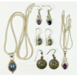 A silver and amethyst pendant and ear rings suite, an blue gem stone and silver pendant and ear ring