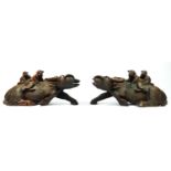 A Chinese pair of carved hardwood recumbent water buffalo with two riders, glass eyes, 36 x 15cm.