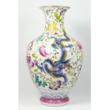 A Chinese famile rouge baluster vase, with blue and pink dragon decoration, 35cm